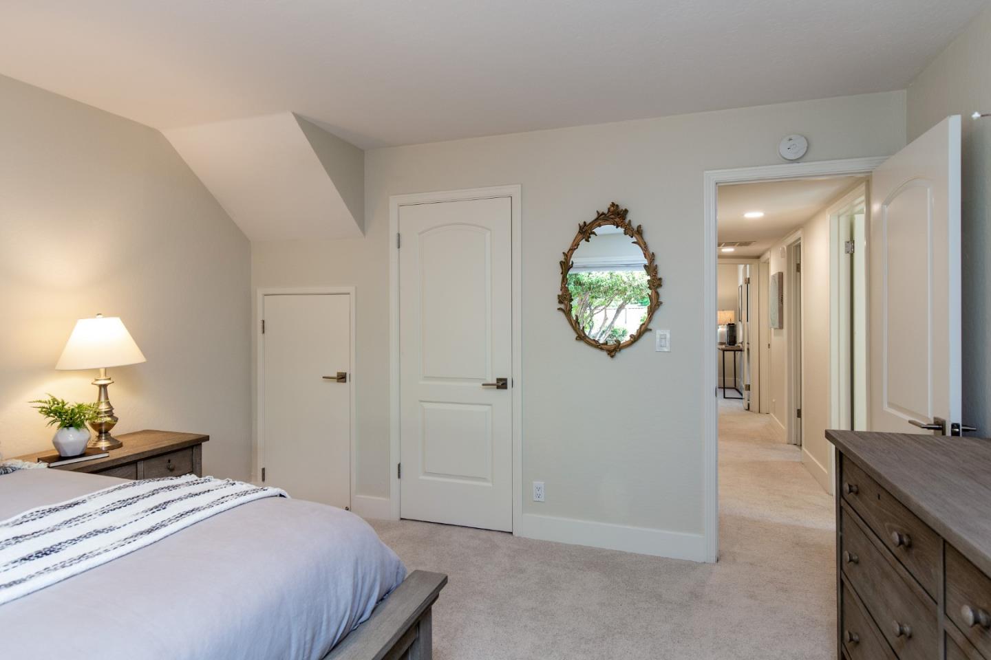 2487 Gunar Drive San Jose, CA 95124 - Photo 17 of 33 a bedroom with a bed and a lamp on dresser
