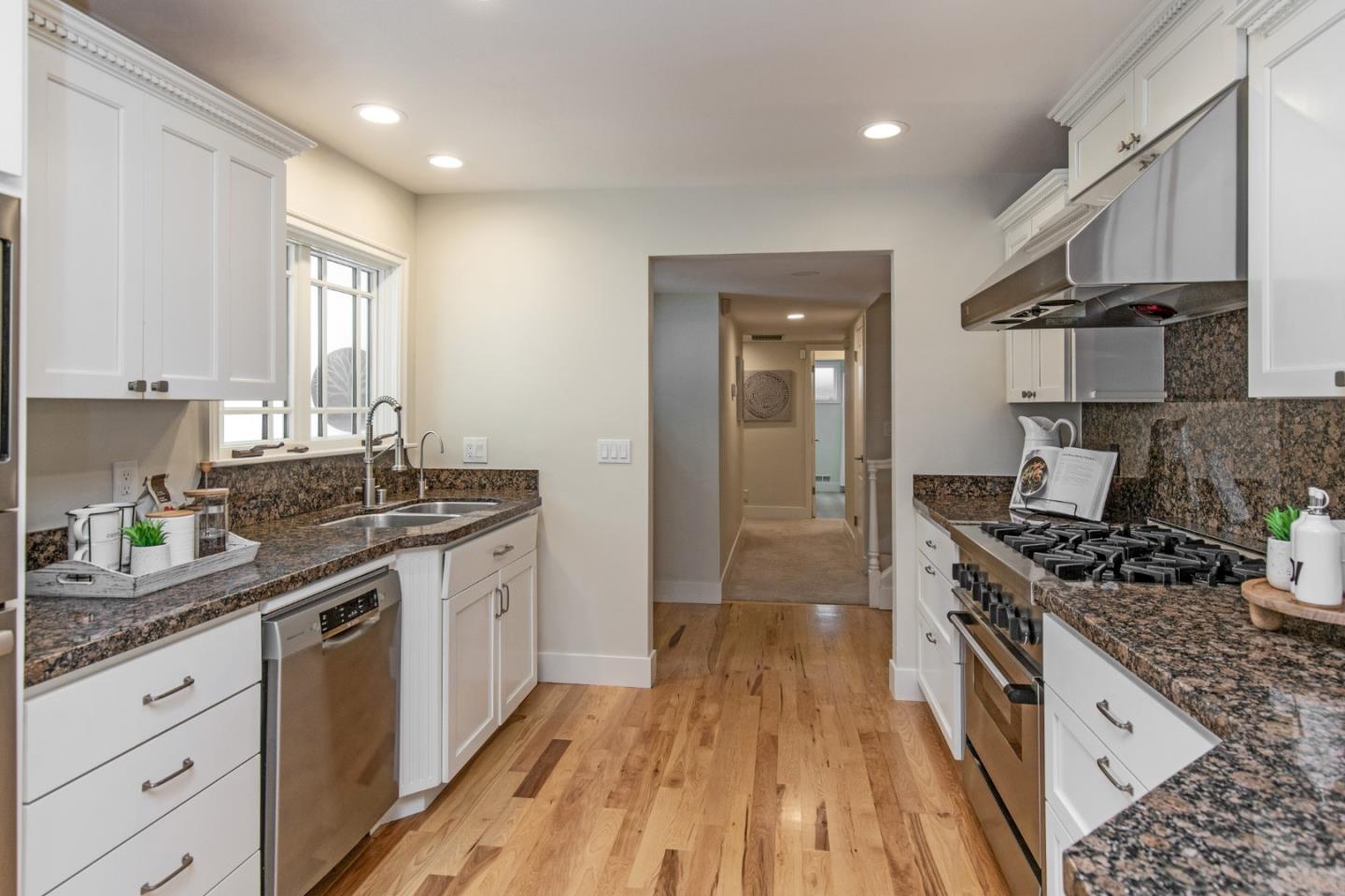2487 Gunar Drive San Jose, CA 95124 - Photo 6 of 33 a kitchen with stainless steel appliances granite countertop a stove and a sink