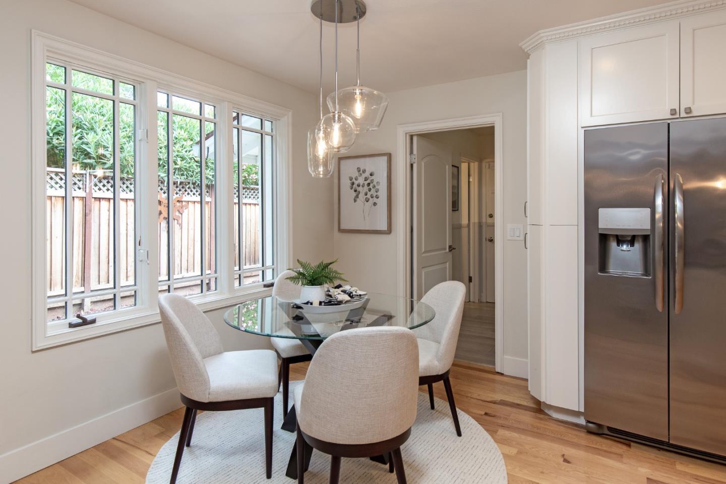 2487 Gunar Drive San Jose, CA 95124 - Photo 7 of 33 a dining room with furniture a chandelier and wooden floor