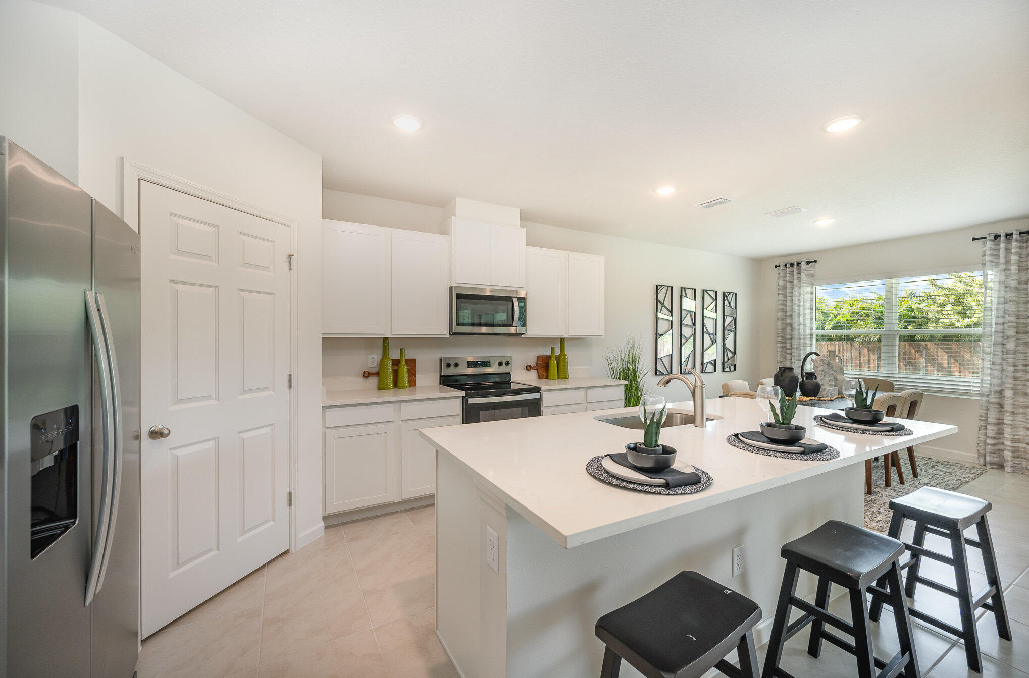 2372 Southwest Lejune Street Port St. Lucie, FL 34953 - Photo 4 of 35 a kitchen with a sink appliances and cabinets