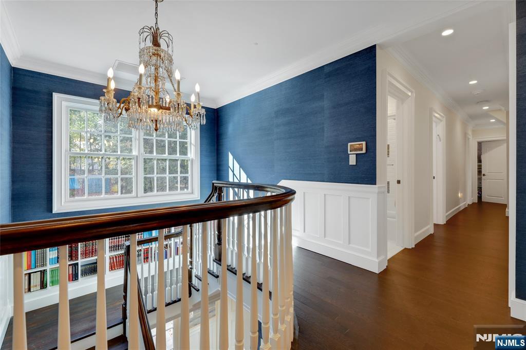 292 Maple Street Englewood, NJ 07631 - Photo 20 of 48 a view of a hallway with wooden floor and staircase