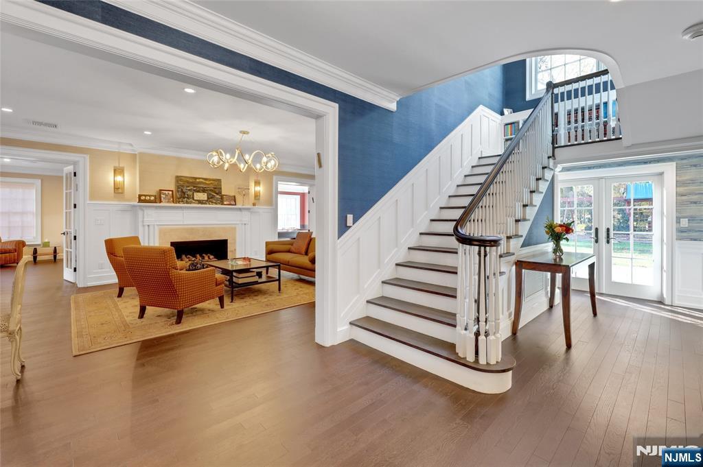 292 Maple Street Englewood, NJ 07631 - Photo 2 of 48 a living room with furniture and a floor to ceiling window
