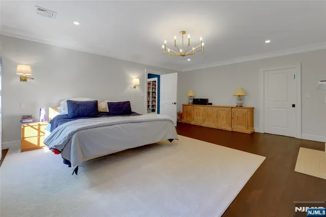 a bedroom with bed and window