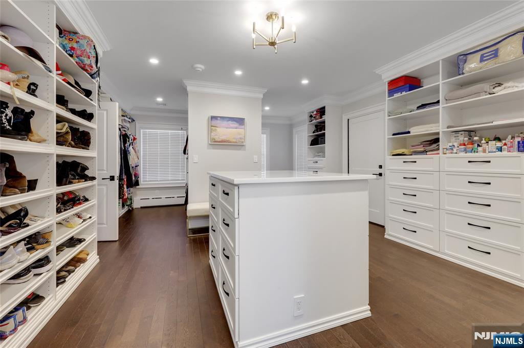 292 Maple Street Englewood, NJ 07631 - Photo 24 of 48 a view of walk in closet with clothes and shoes