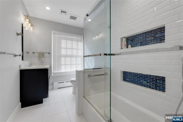 a bathroom with a bathtub and a shower