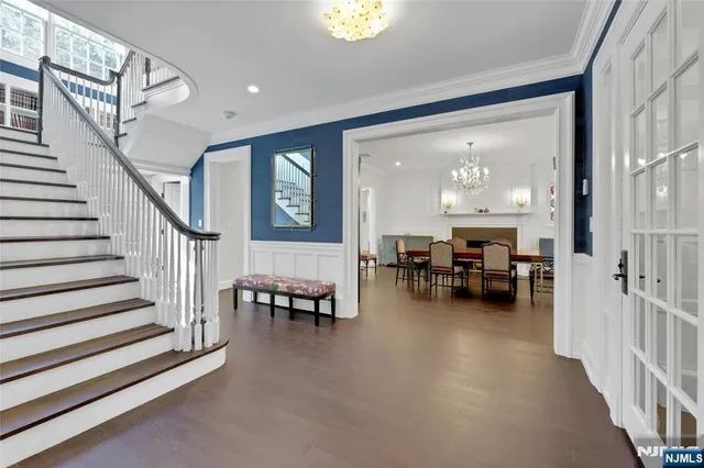 a view of a livingroom with furniture and stairs