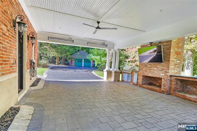 a view of a porch with furniture and a yard