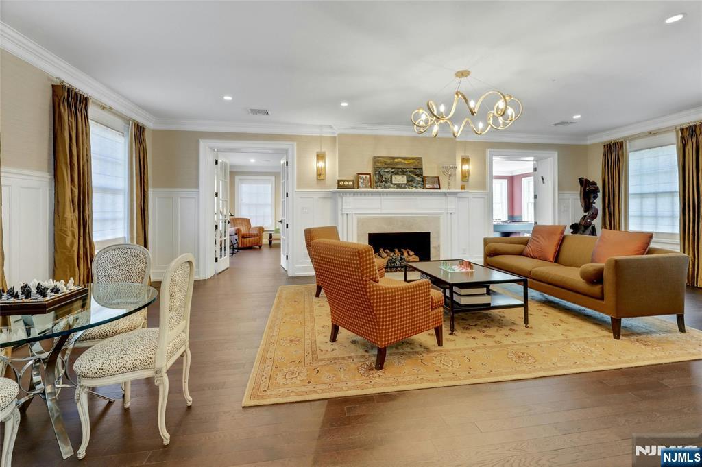 292 Maple Street Englewood, NJ 07631 - Photo 5 of 48 a living room with furniture chandelier and a fireplace