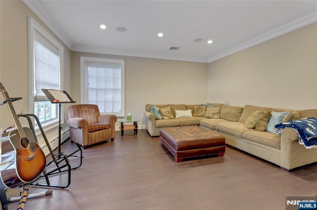 292 Maple Street Englewood, NJ 07631 - Photo 9 of 48 a living room with furniture and gym equipment