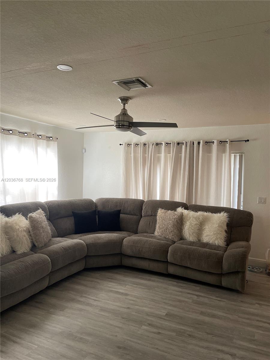2432 Southwest 99th Way Miramar, FL 33025 - Photo 15 of 17 a living room with furniture and a large window