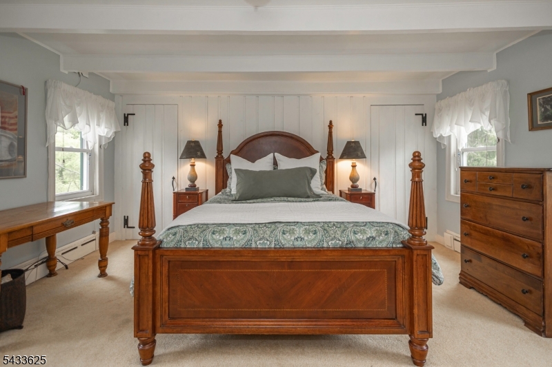 449 Stamets Road Milford, NJ 08848 - Photo 25 of 44 a bedroom with a bed and a dresser with mirror