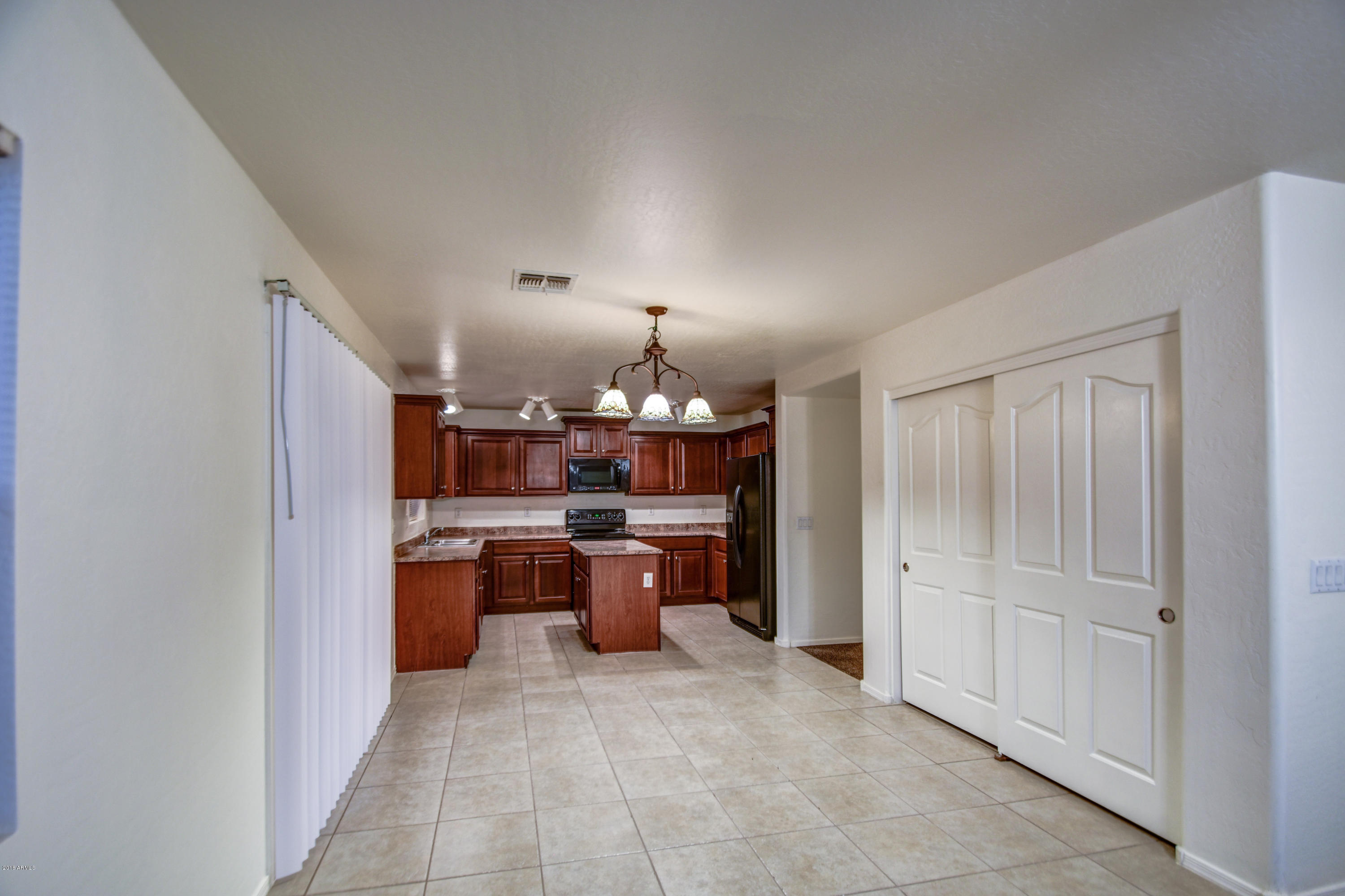 4146 East Morenci Road San Tan Valley, AZ 85143 - Photo 8 of 48 Family room to kitchen