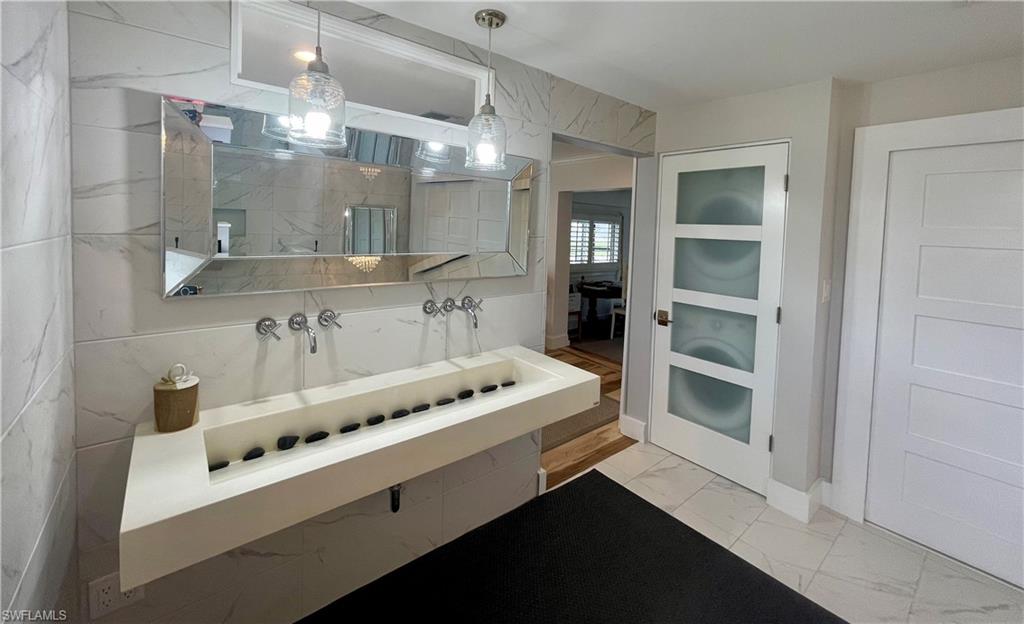 2120 Sandpiper Street Naples, FL 34102 - Photo 22 of 48 Floating sink with dual faucets