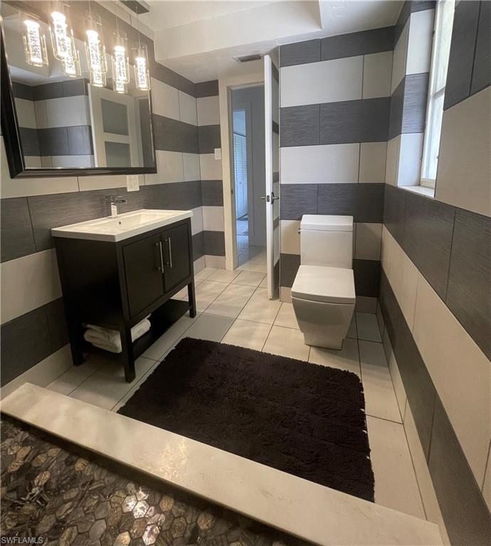 2120 Sandpiper Street Naples, FL 34102 - Photo 27 of 48 tiled guest bath