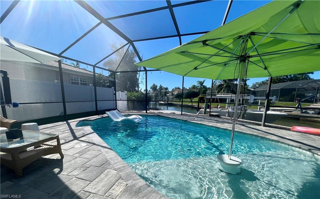 2120 Sandpiper Street Naples, FL 34102 - Photo 33 of 48 Pool with baja shelf and 2 bubblers