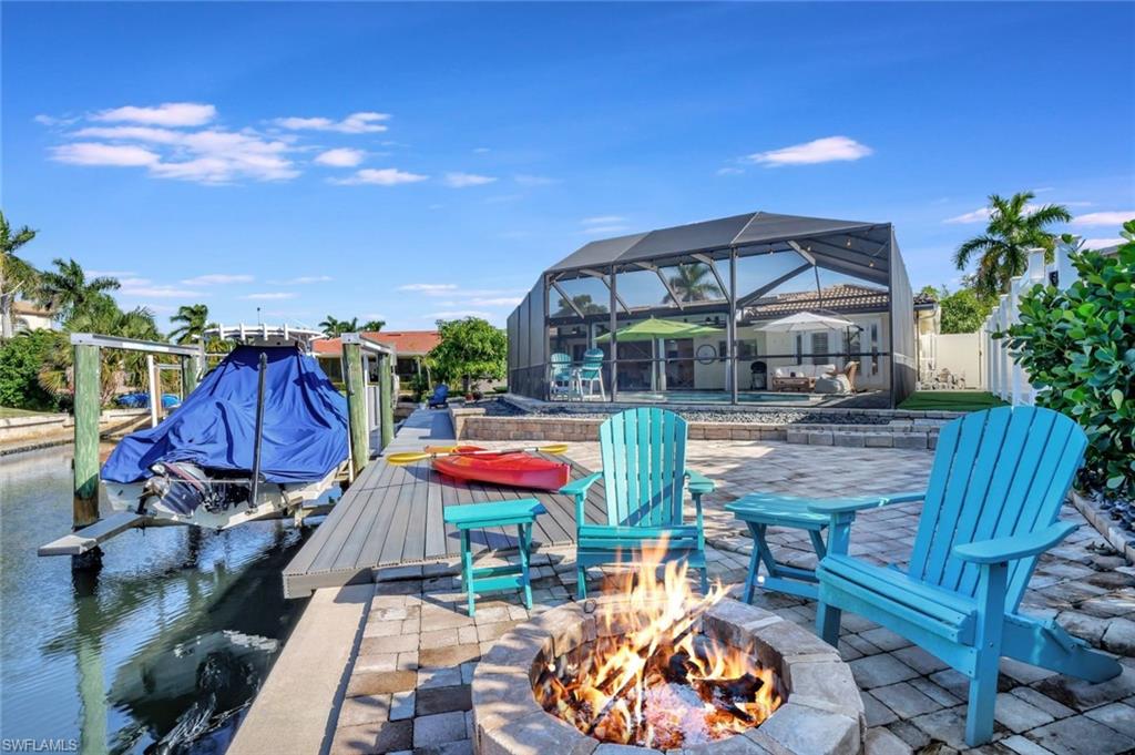 2120 Sandpiper Street Naples, FL 34102 - Photo 40 of 48 fire pit over canal