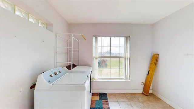 a utility room with dryer and washer