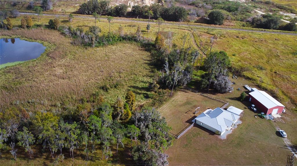 1193 Sand Mountain Road Fort Meade, FL 33841 - Photo 28 of 33 a aerial view of a house with a yard and lake view