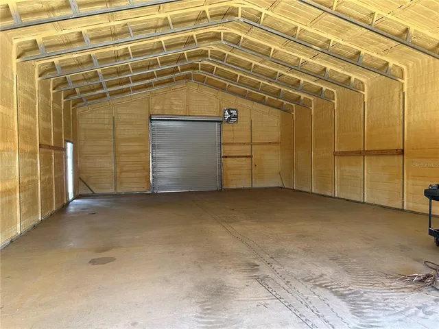 a view of a garage with wooden wall