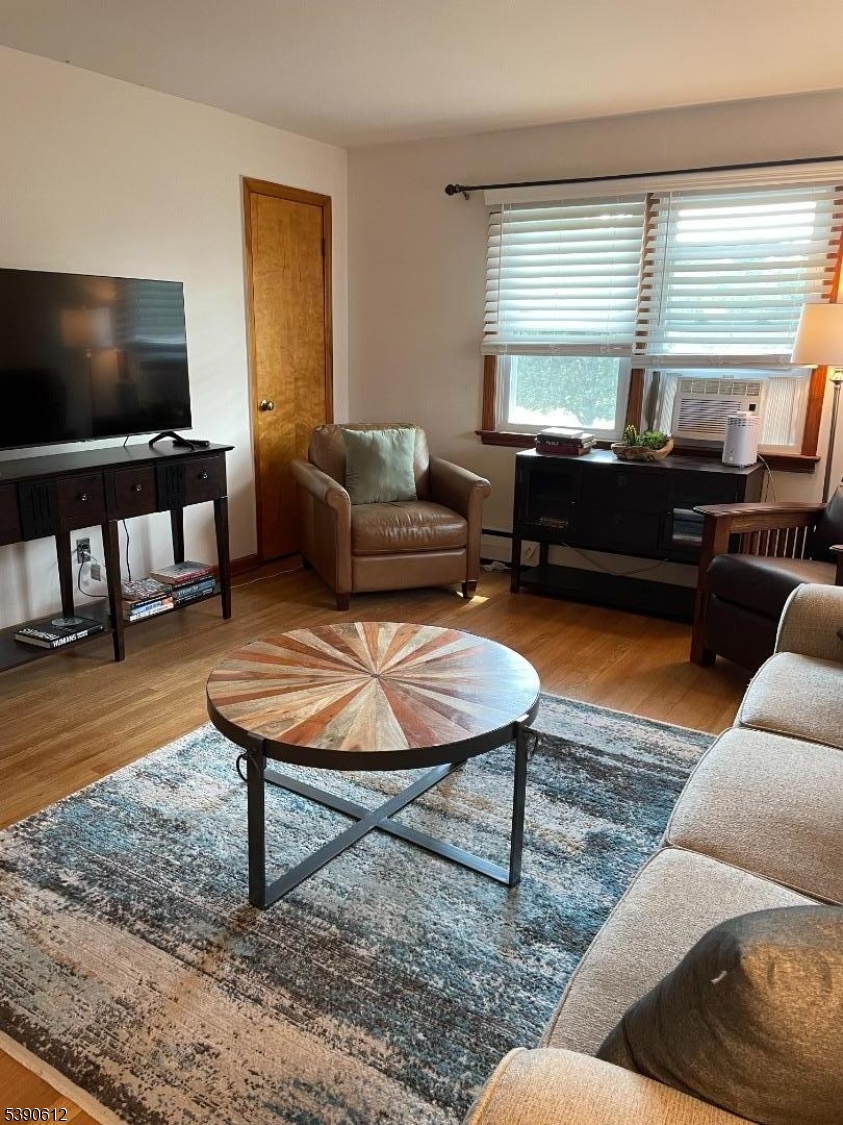 623 Bloomfield Avenue West Caldwell, NJ 07006 - Photo 1 of 13 a living room with furniture and a flat screen tv