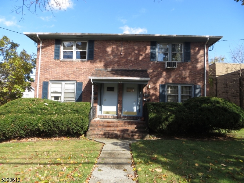 623 Bloomfield Avenue West Caldwell, NJ 07006 - Photo 2 of 13 a front view of a house with a garden