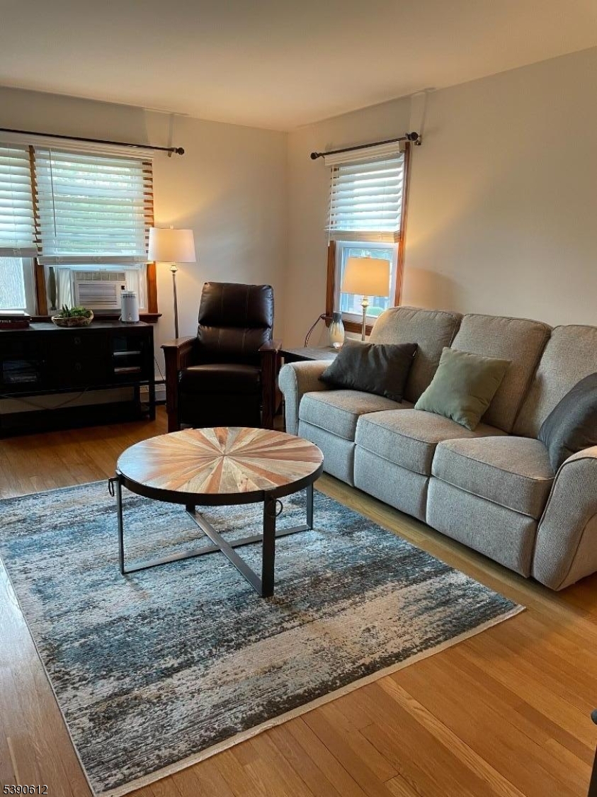 623 Bloomfield Avenue West Caldwell, NJ 07006 - Photo 3 of 13 a living room with furniture and a rug