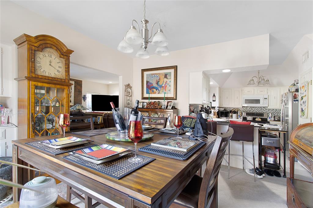 4988 Thunder Road Dallas, TX 75244 - Photo 12 of 31 a living room with lots of furniture and a flat screen tv