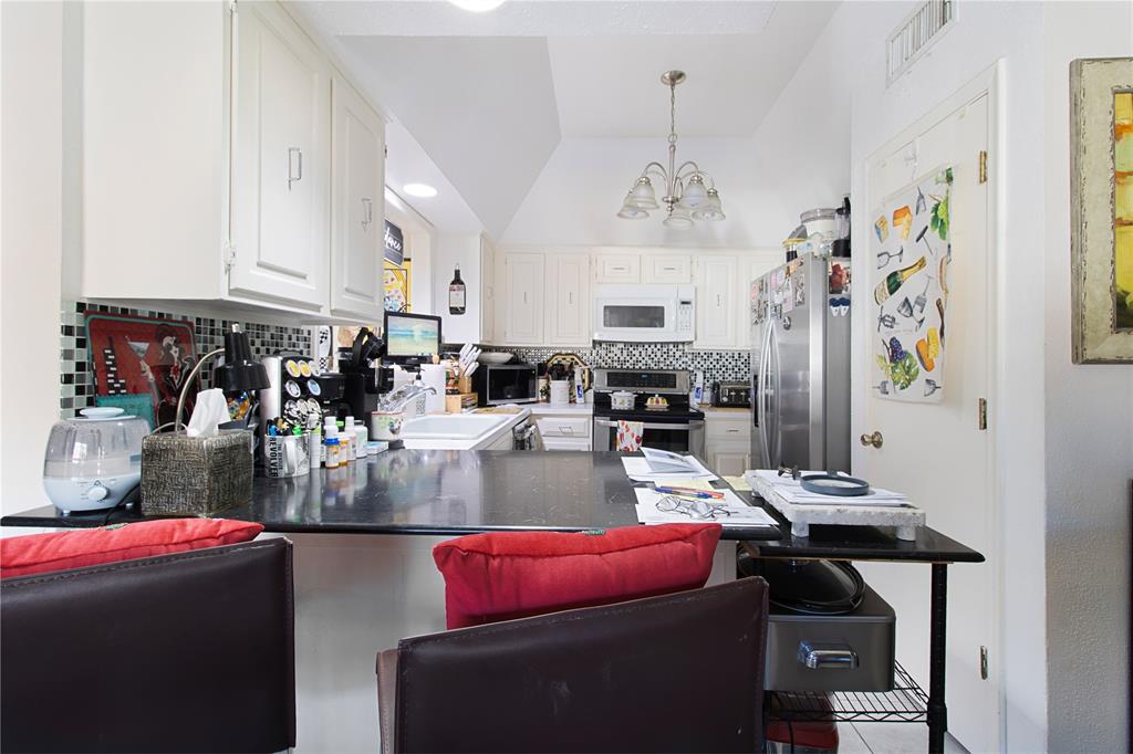 4988 Thunder Road Dallas, TX 75244 - Photo 13 of 31 a view of a dining room with furniture