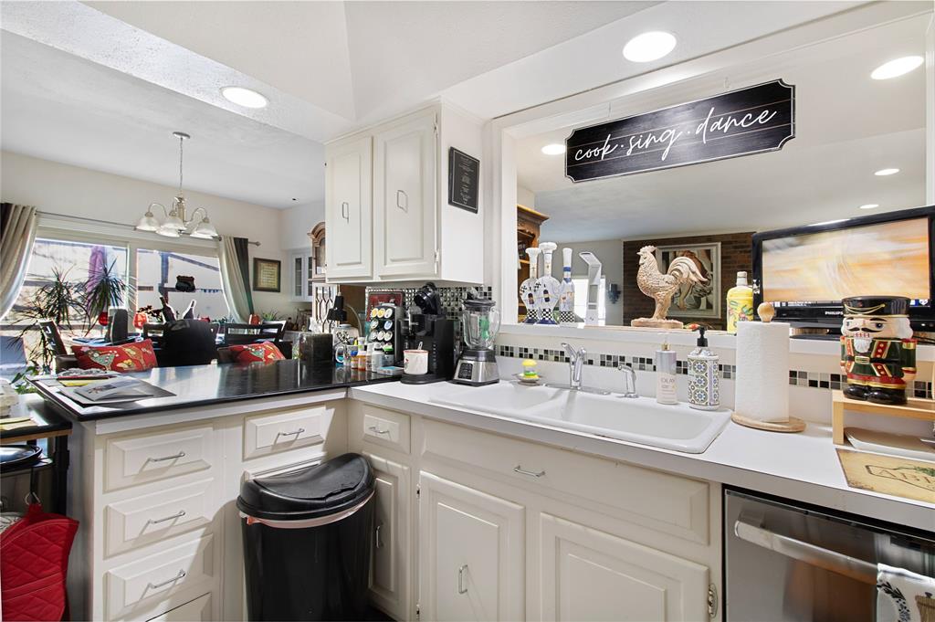 4988 Thunder Road Dallas, TX 75244 - Photo 14 of 31 a kitchen with lots of counter space and wooden floor