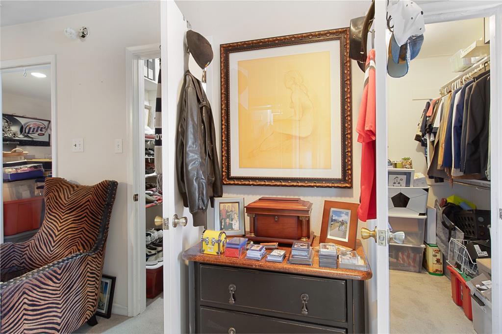 4988 Thunder Road Dallas, TX 75244 - Photo 20 of 31 a view of walk in closet with clothes and shoes