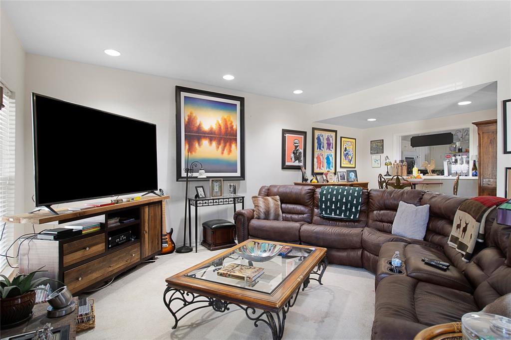 4988 Thunder Road Dallas, TX 75244 - Photo 3 of 31 a living room with furniture and a flat screen tv