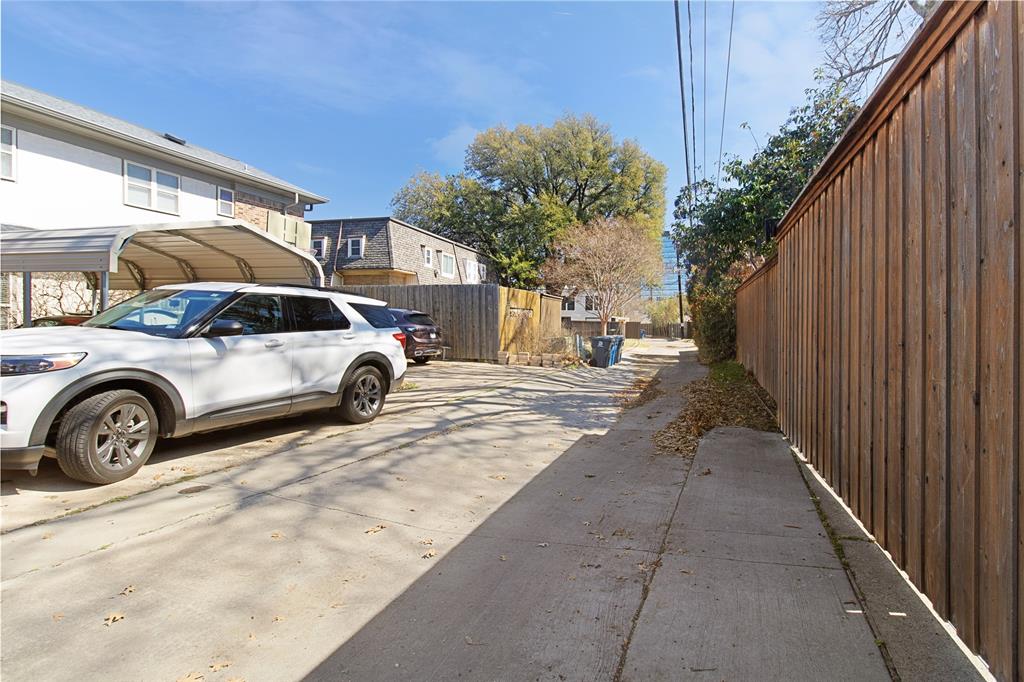 4988 Thunder Road Dallas, TX 75244 - Photo 31 of 31 a view of a car parked in front of a house