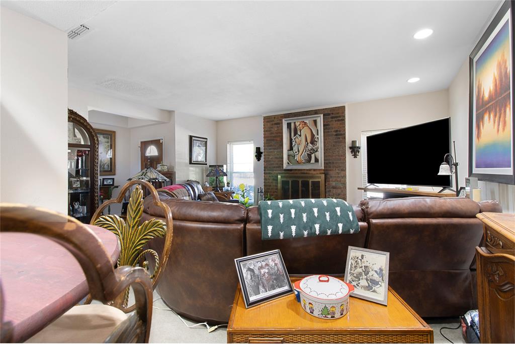 4988 Thunder Road Dallas, TX 75244 - Photo 7 of 31 a living room with furniture and a flat screen tv