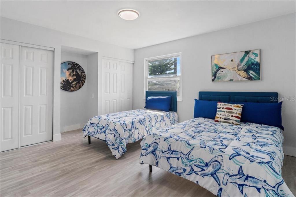 307 161st Avenue Redington Beach, FL 33708 - Photo 33 of 39 a bedroom with bed and wall painting