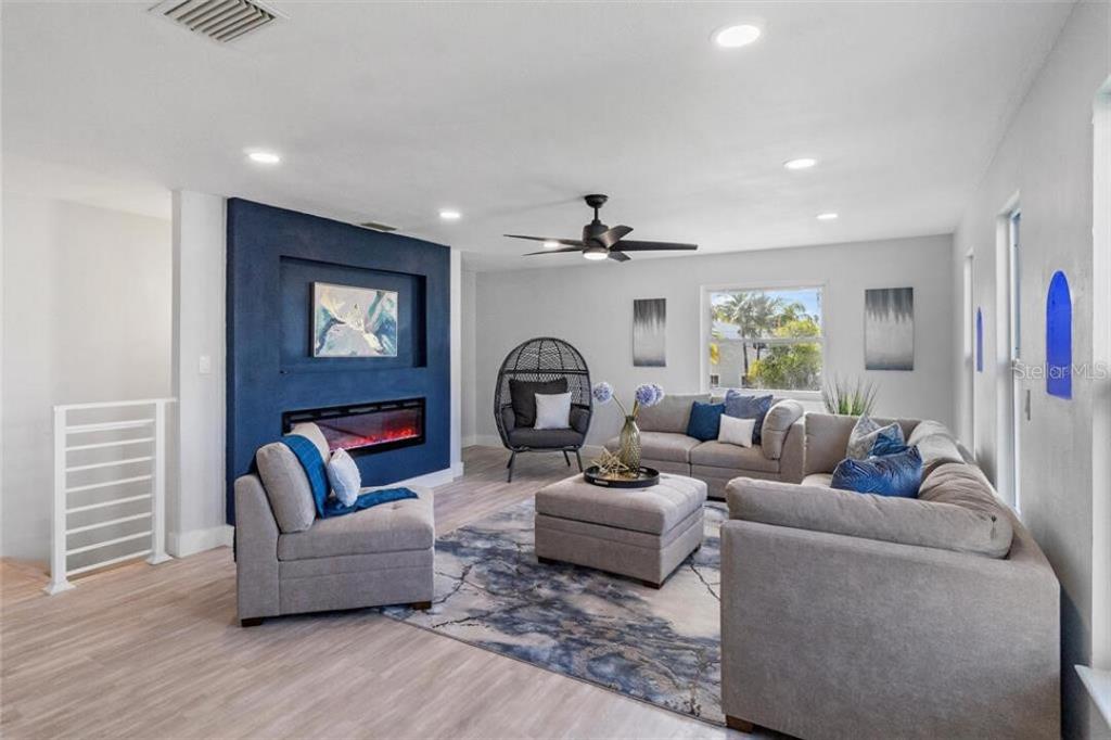307 161st Avenue Redington Beach, FL 33708 - Photo 8 of 39 a living room with furniture and a wooden floor