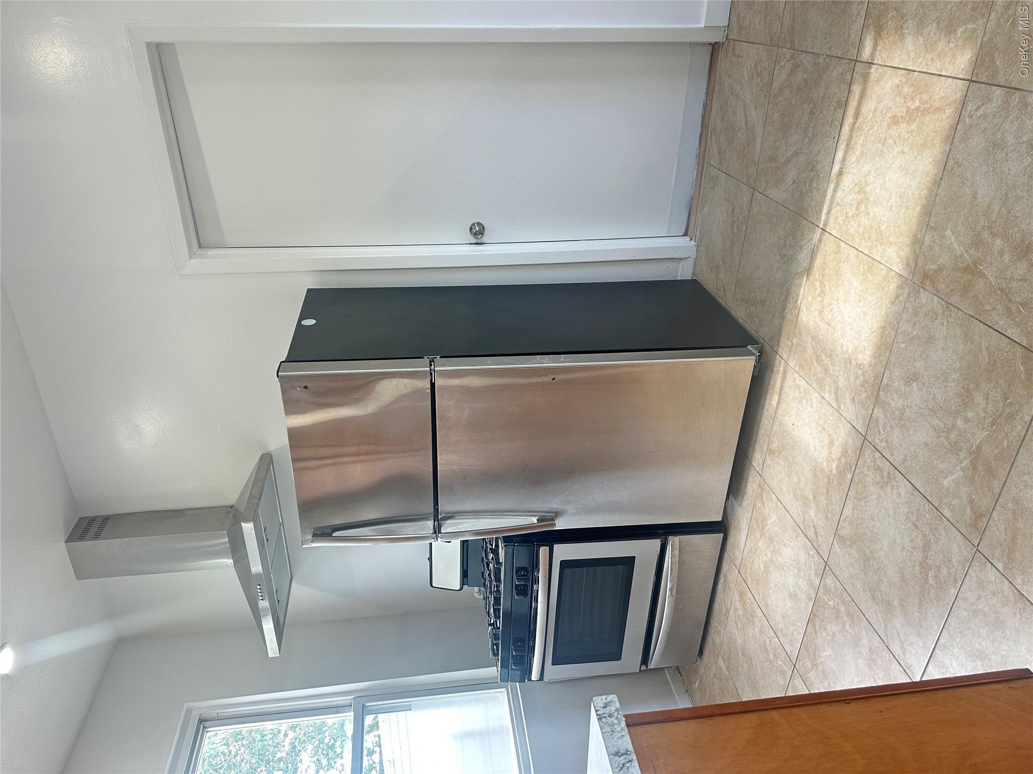 108-69 50th Avenue Queens, NY 11368 - Photo 1 of 10 a kitchen with stainless steel appliances granite countertop a refrigerator and a sink
