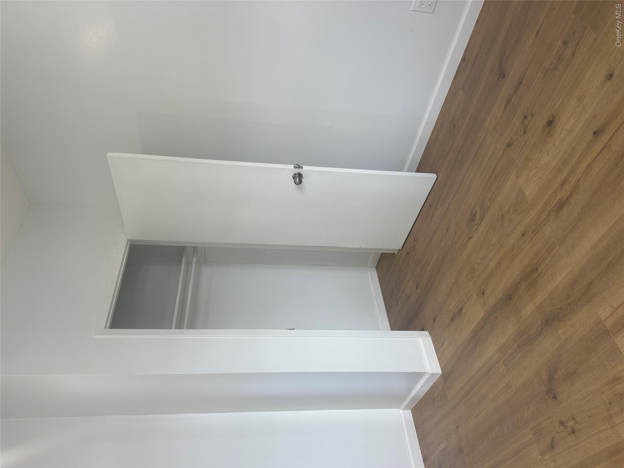 108-69 50th Avenue Queens, NY 11368 - Photo 8 of 10 a view of an empty room with wooden floor