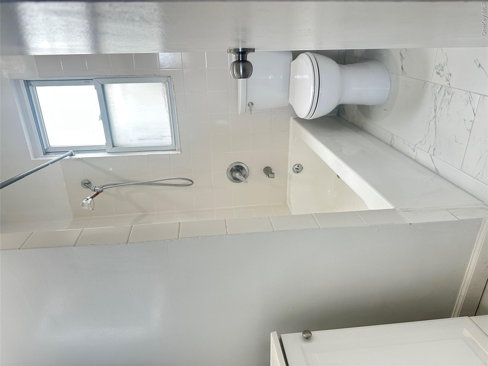 108-69 50th Avenue Queens, NY 11368 - Photo 10 of 10 a bathroom with a toilet and a bathtub
