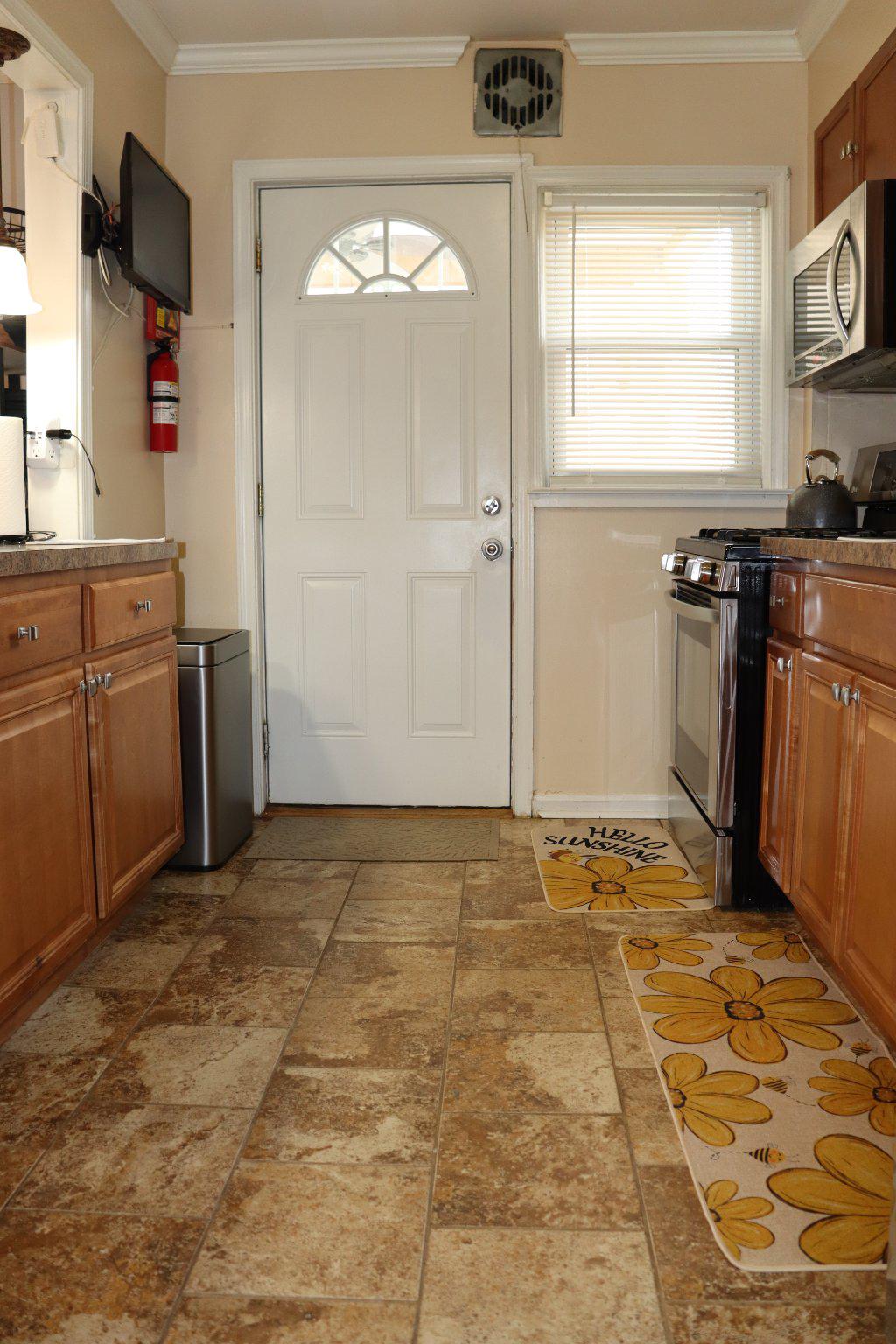 1328 Cedarcroft Road Baltimore, MD 21239 - Photo 9 of 39 Kitchen with tile floors and rear door access.