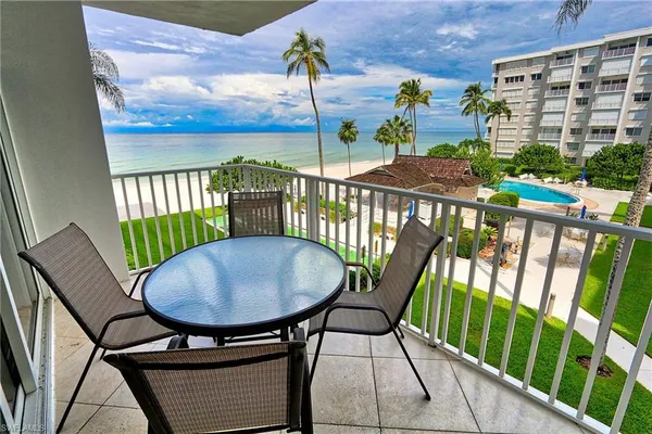 a view of a balcony with chairs