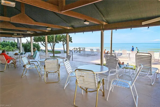 a view of an outdoor dining space with furniture