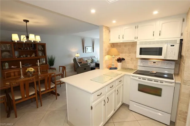 a kitchen that has a stove and a table