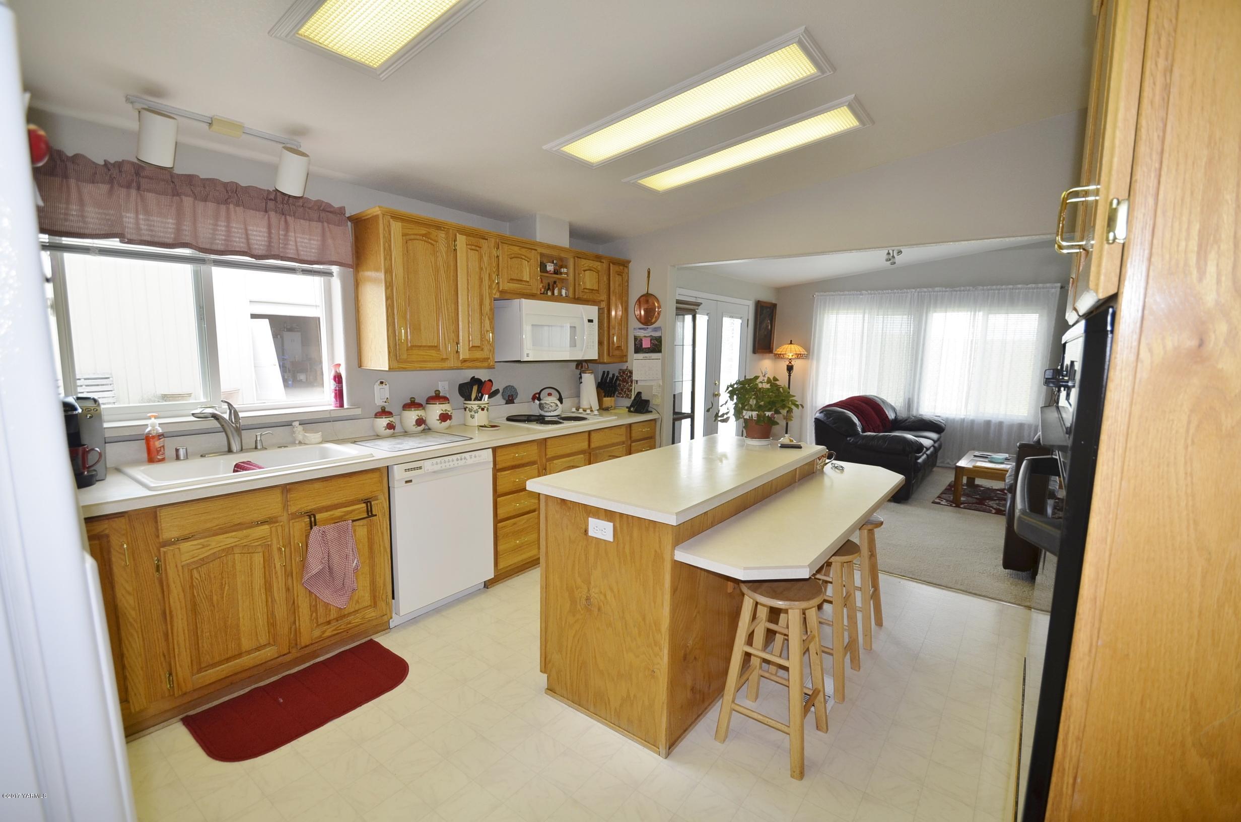 1454 Konnowac Pass Road Moxee, WA 98936 - Photo 29 of 34 a kitchen with a sink a counter top space and appliances