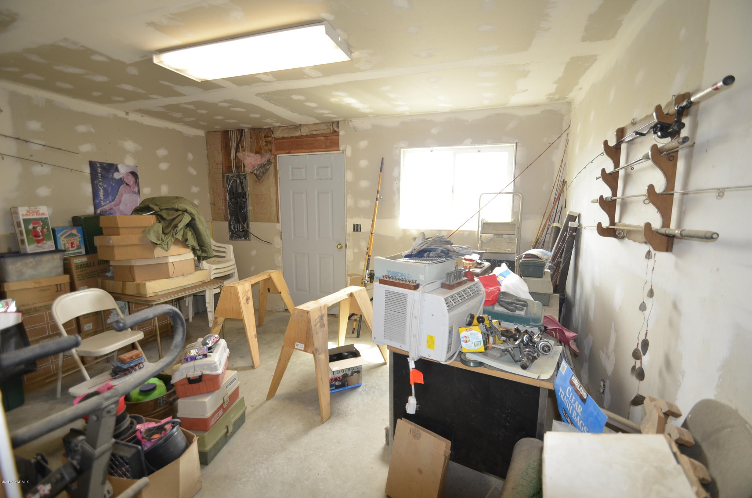 1454 Konnowac Pass Road Moxee, WA 98936 - Photo 32 of 34 a very nice looking room with many windows and furniture