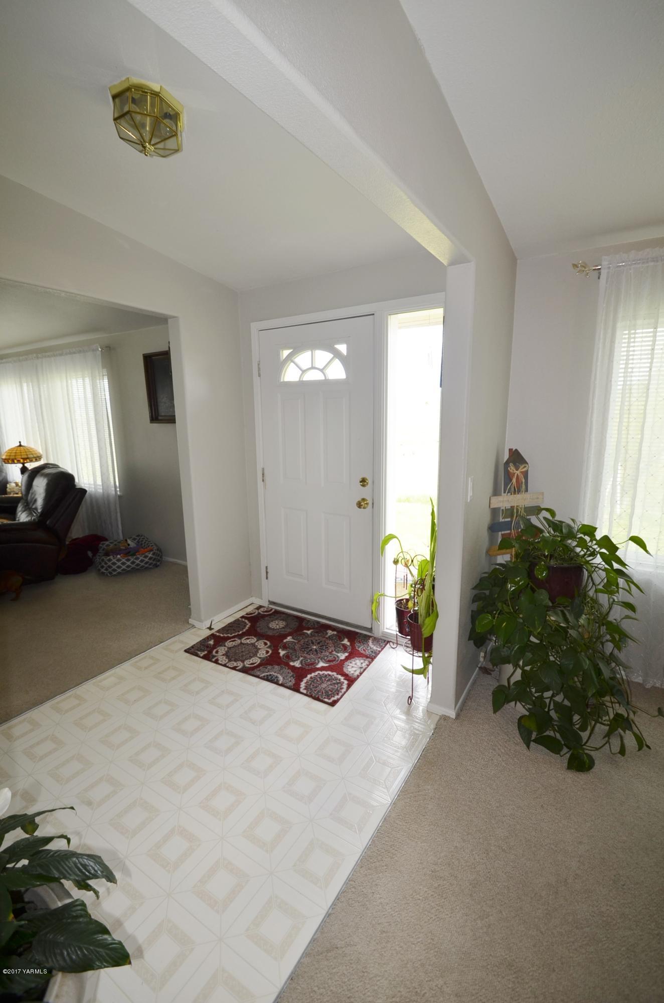 1454 Konnowac Pass Road Moxee, WA 98936 - Photo 7 of 34 a bedroom with a bed and a cabinets