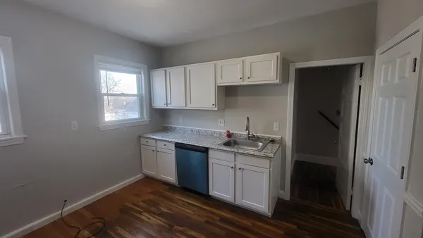 a kitchen with stainless steel appliances granite countertop a stove and a refrigerator