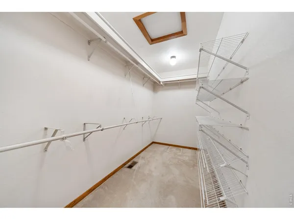 a view of hallway with wooden floor