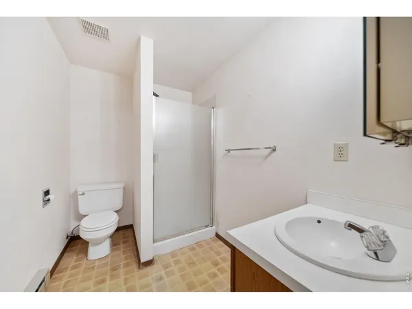 a view of an empty room with stairs