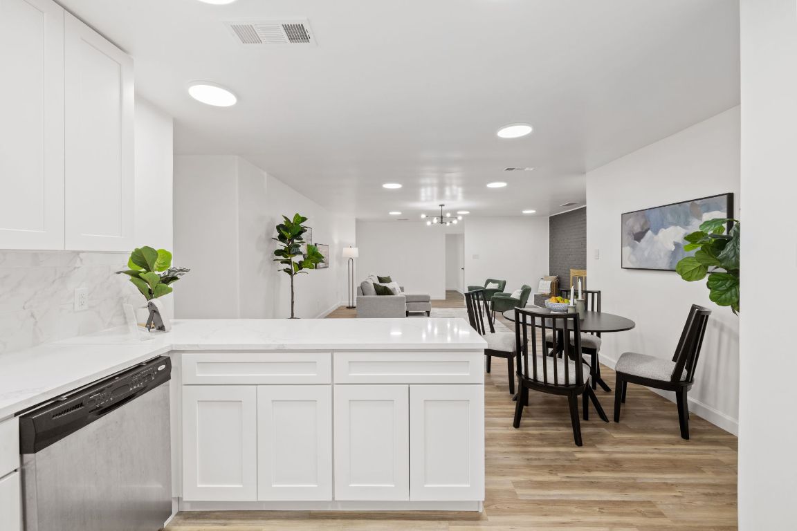 902 Virginia Drive Round Rock, TX 78664 - Photo 33 of 33 a dining room with furniture and potted plants