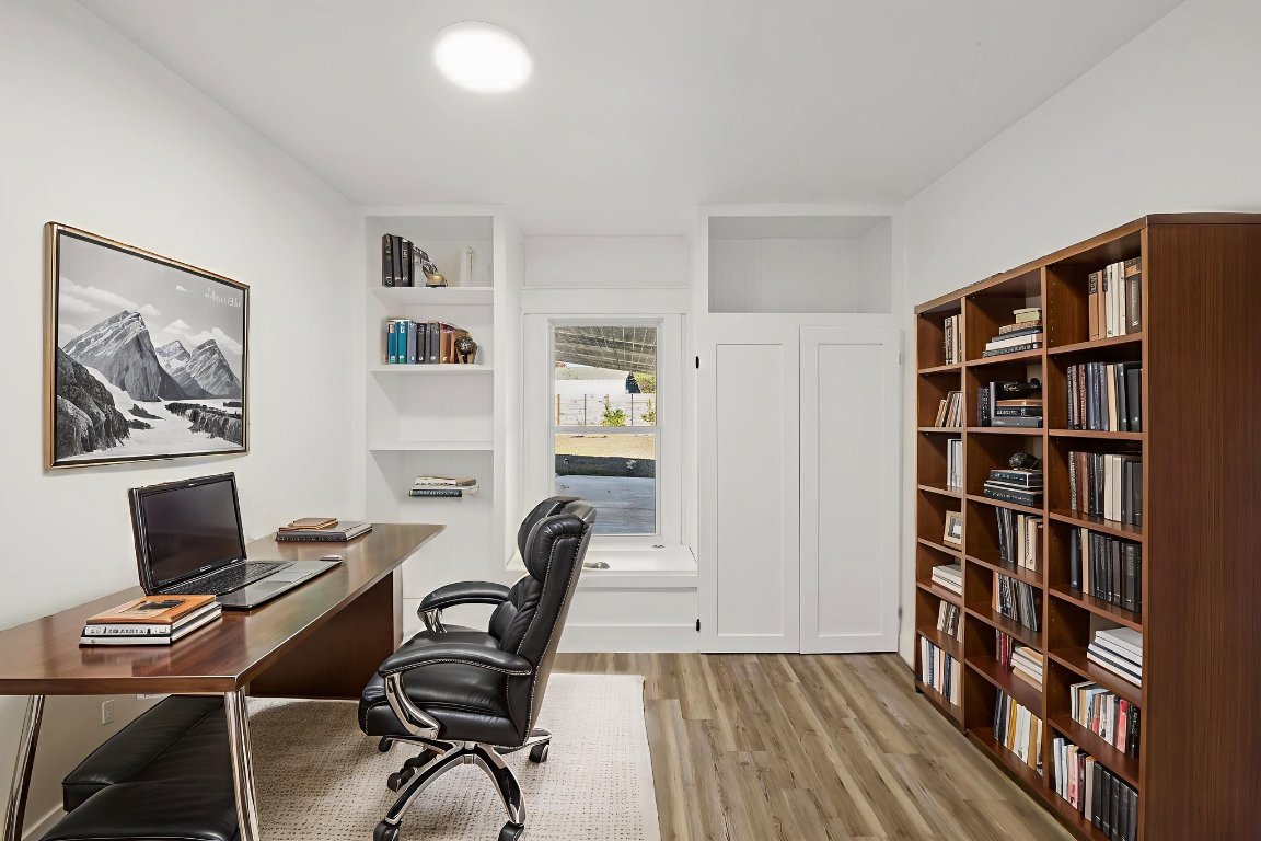 902 Virginia Drive Round Rock, TX 78664 - Photo 17 of 33 a view of a workspace with furniture and wooden floor